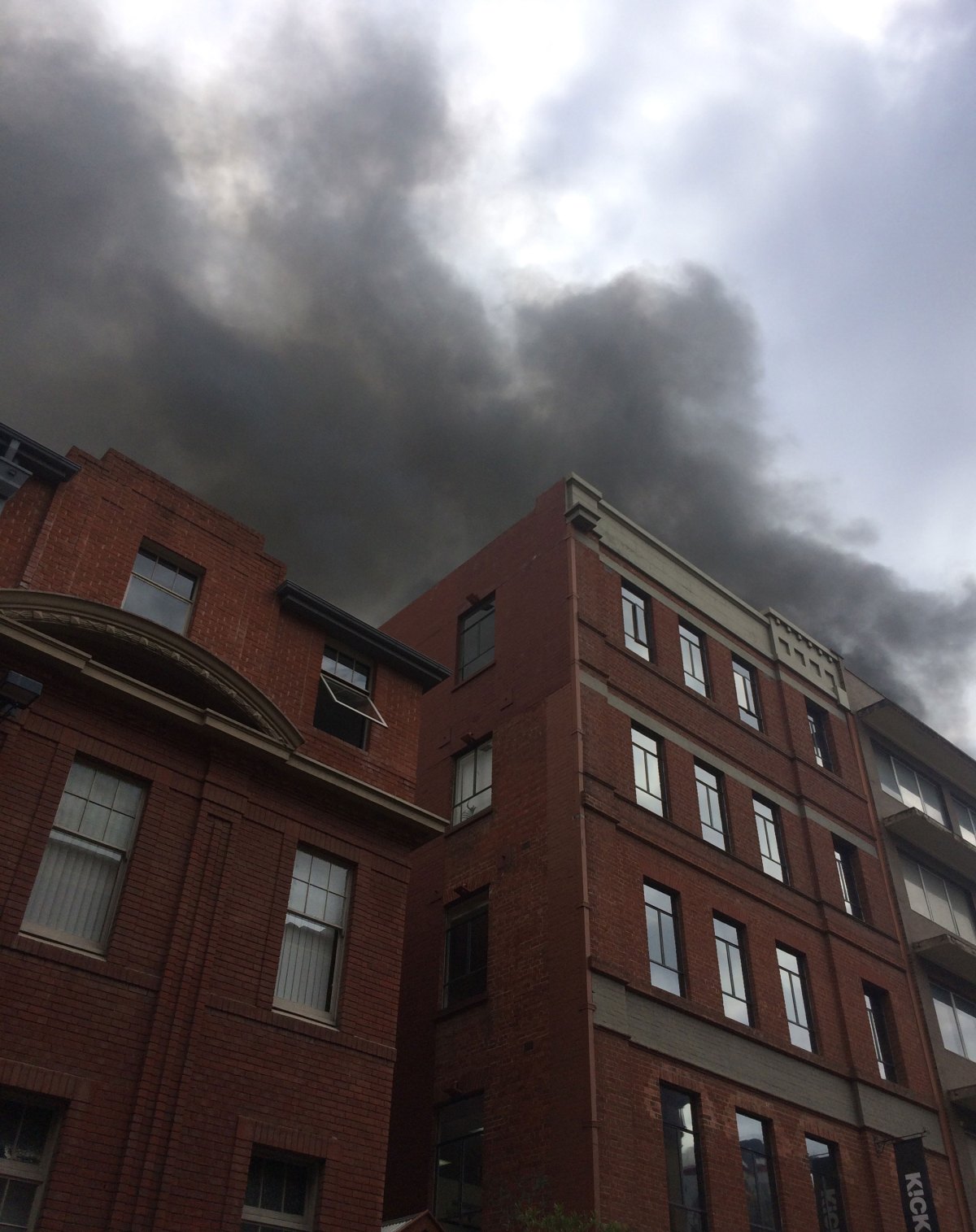 Smoke rises above Leigh St.