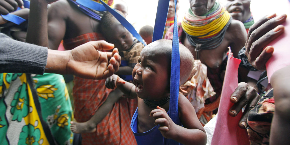 A child cries as he is weighed at a health centre in the Kakuma refugee camp. EPA image