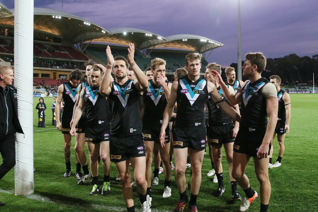 Port players thanks supporters as they leave Adelaide Oval for the final time in 2015.