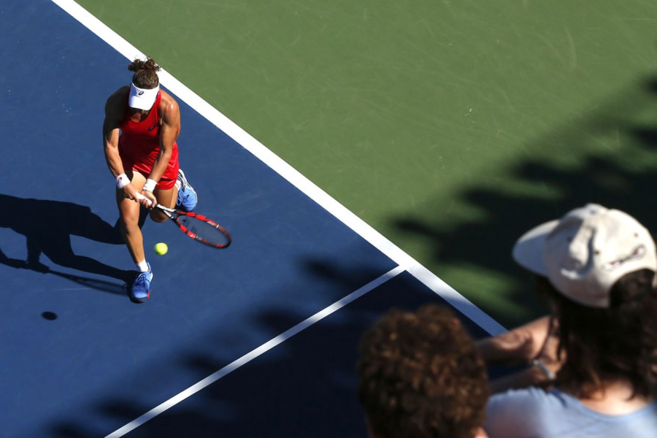Samantha Stosur returns a shot to Sara Errani during their round three match at the US Open.