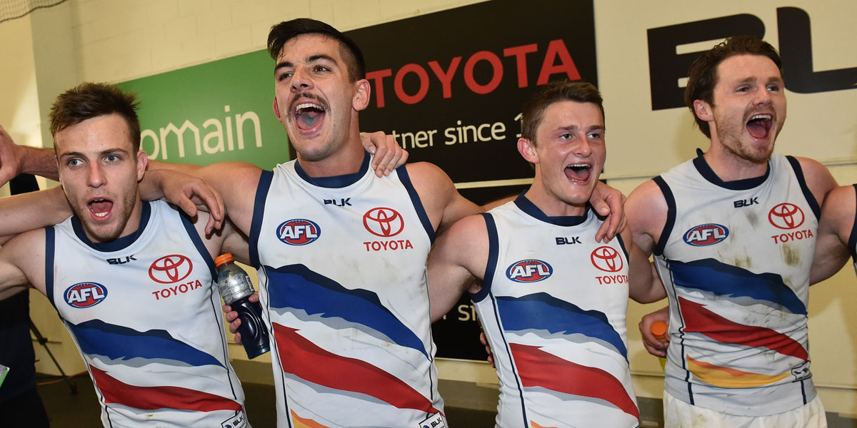 Brodie Smith, Taylor Walker, Rory Laird and Patrick Dangerfield in full voice after the match. AAP Image
