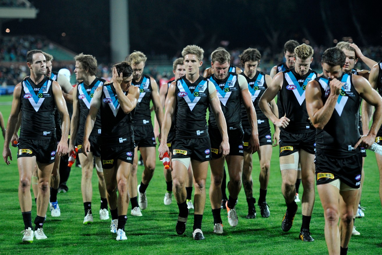 Port players leave the field after one of their 10 losses for the season.