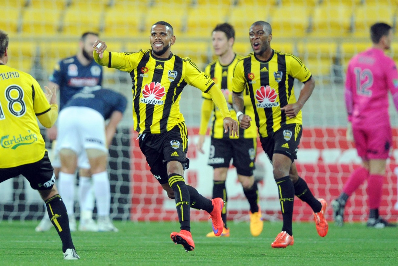 Wellington Phoenix's Kenny Cunningham (centre) celebrates after scoring a goal during against the Central Coast Mariners.