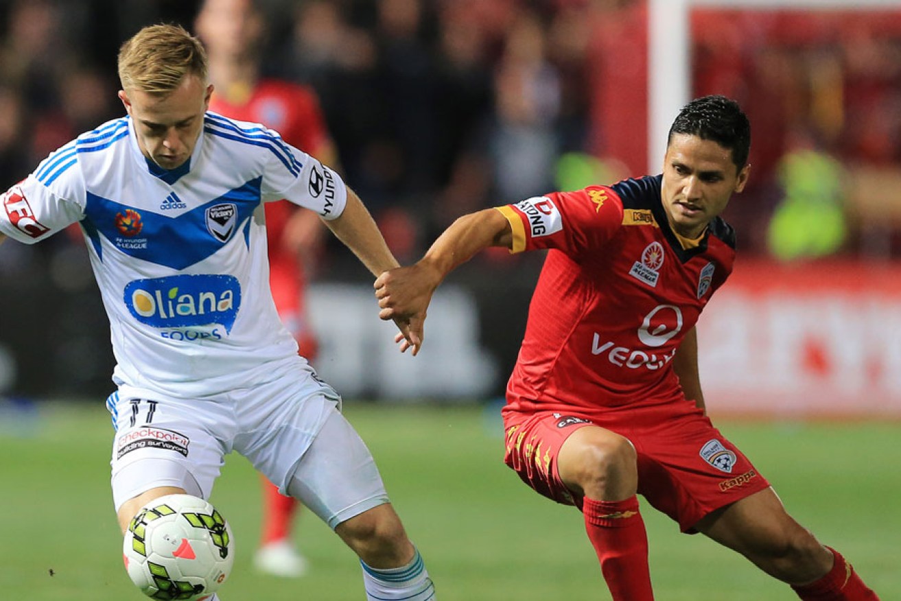 Marcelo Carrusca (right) will be crucial for Adelaide United tonight. AAP photo