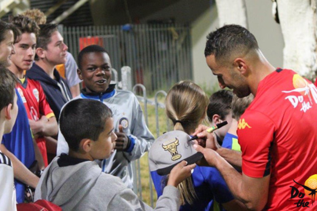 Adelaide United players talk to locals during their recent visit to the Top End. Photo: AdelaideUnited.com.au