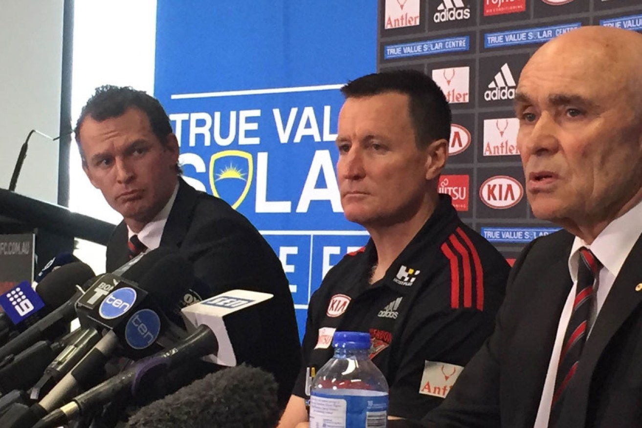 Essendon CEO Xavier Campbell (left) and chairman Paul Little (right) announce John Worsfold as the club's new coach for 2016-2018. AAP Image