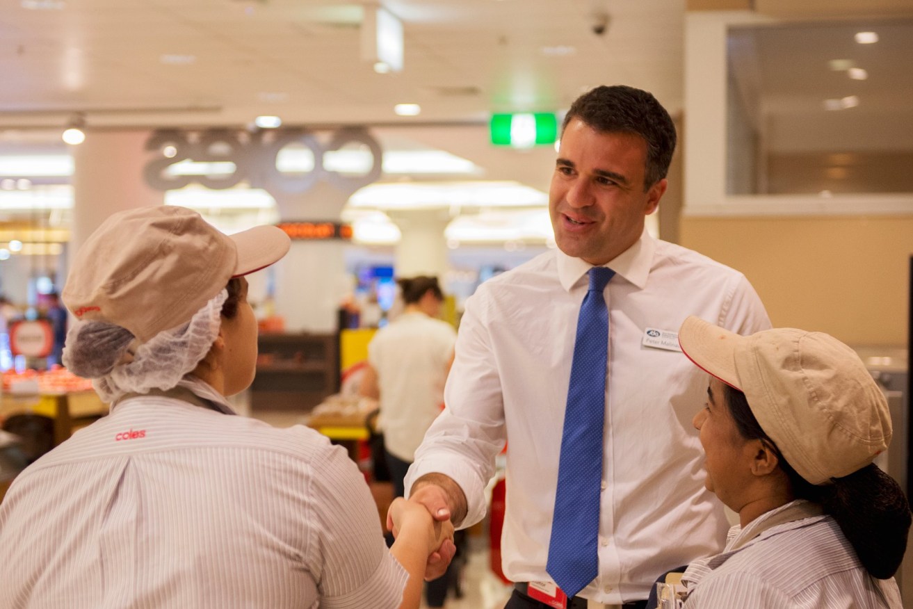 Peter Malinauskas chats with workers. Photo: Facebook