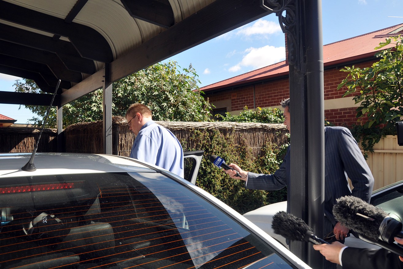 Bernard Finnigan leaves his northern suburbs home amid media attention in 2011.
