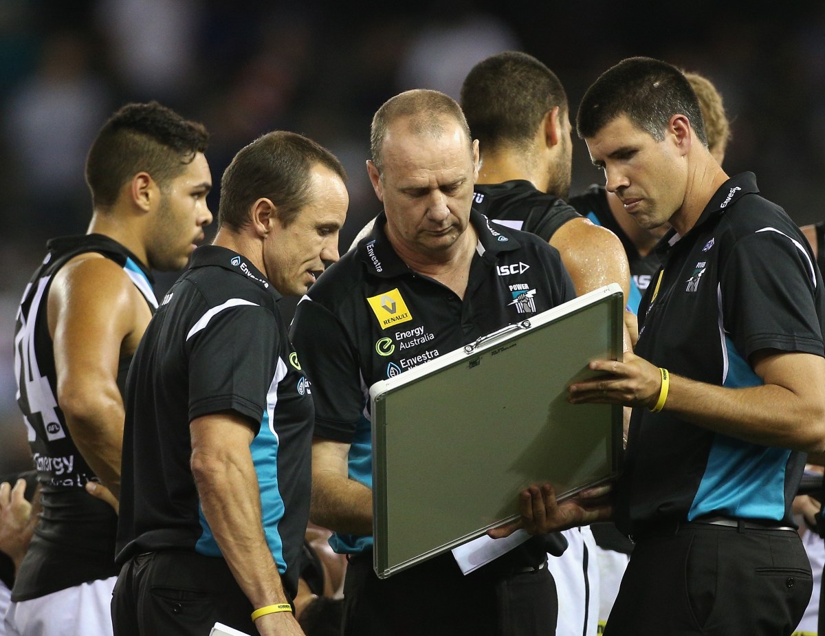 Ken Hinkley coach of Port works his positions on the whiteboard during the Round 3 AFL match between the North Melbourne Kangaroos and Port Adelaide Power at Etihad Stadium in Melbourne, Sunday, April 6, 2014. (AAP Image/Mark Dadswell) NO ARCHIVING, EDITORIAL USE ONLY