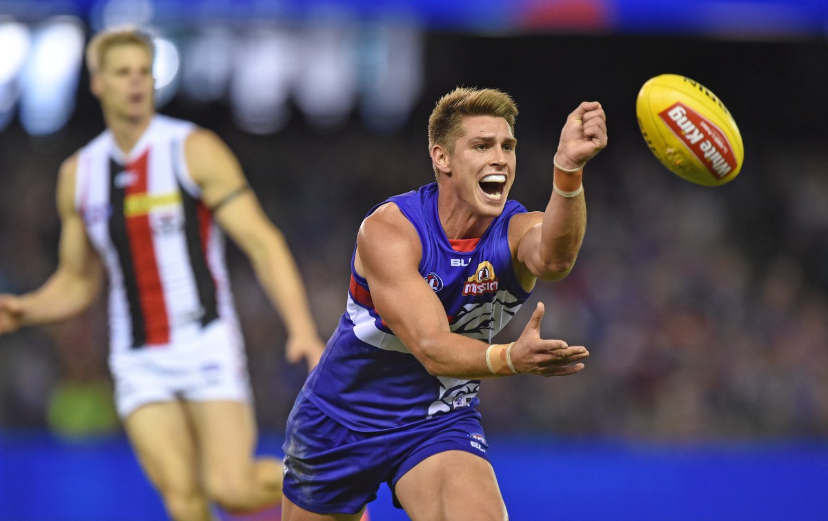 Michael Talia of the Bulldogs passes the ball, during the round 6 AFL match between the Western Bulldogs and St Kilda Saints, at Etihad stadium in Melbourne, Saturday May 9, 2015. (AAP Image/Joe Castro) NO ARCHIVING, EDITORIAL USE ONLY