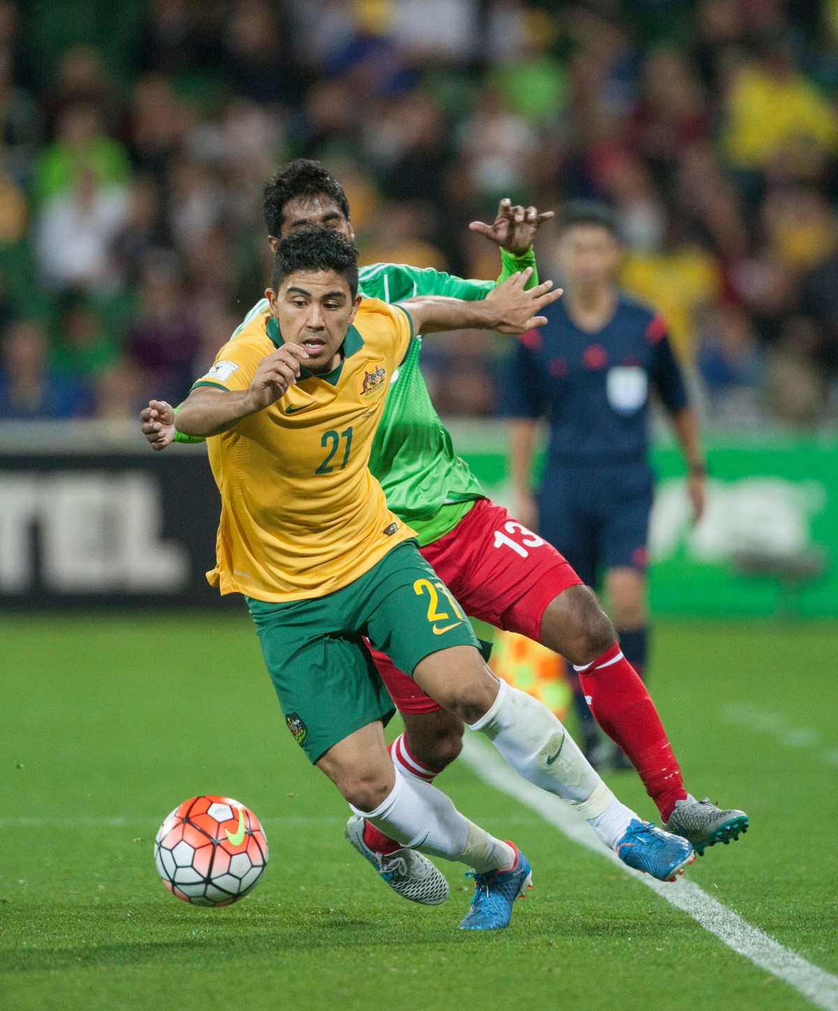 Massimo Luongo for the Socceroos and Monaem Khan Raju for Bangladesh during the World Cup qualifier match between Australia and Bangladesh at NIB Stadium in Perth, Thursday Sept. 3, 2015. (AAP Image/Tony McDonough) NO ARCHIVING, EDITORIAL USE ONLY