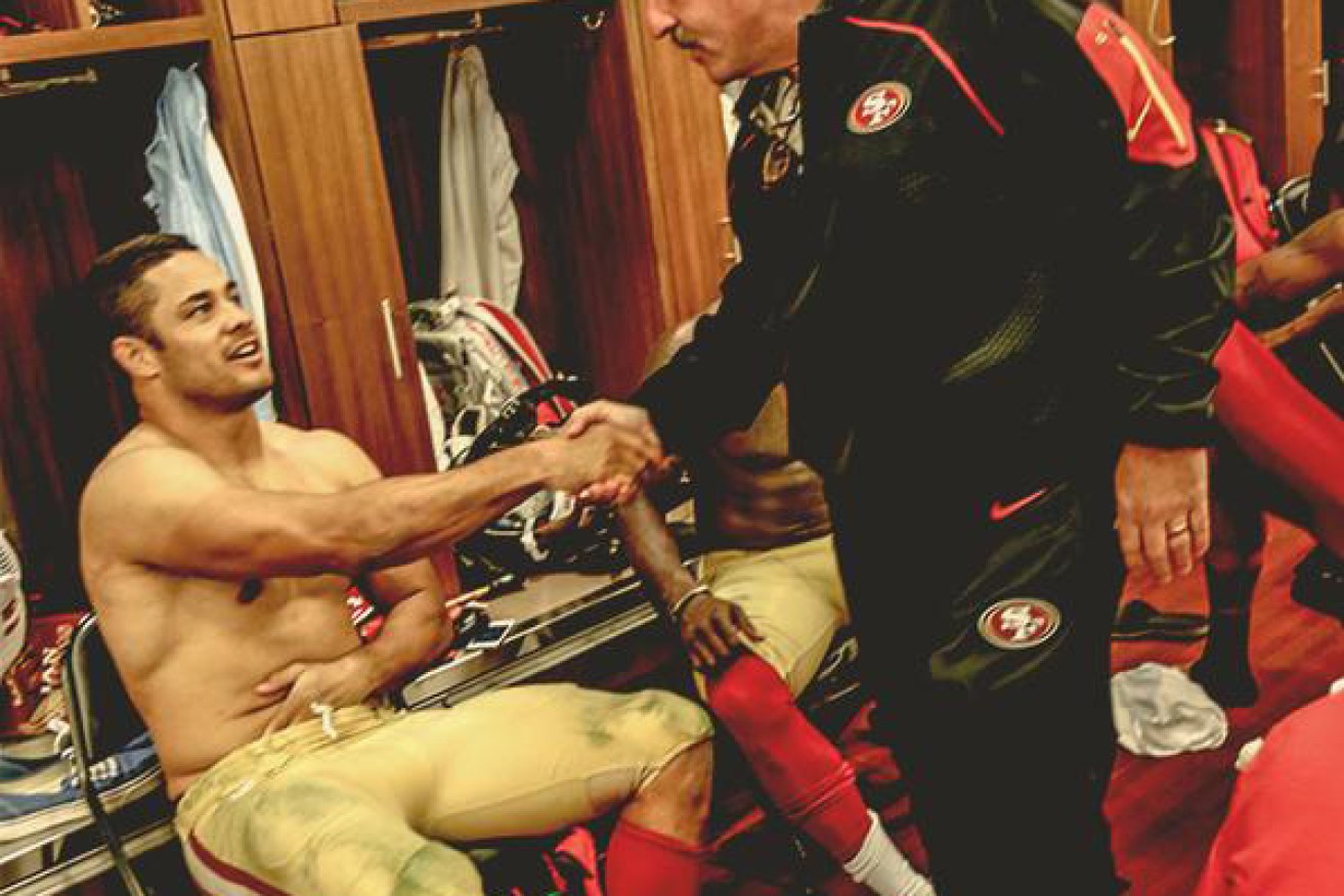 Seen better days: Hayne is congratulated by coach Jim Tomsula after making the cut for the 49ers' 53-man squad. He was cut this week.
