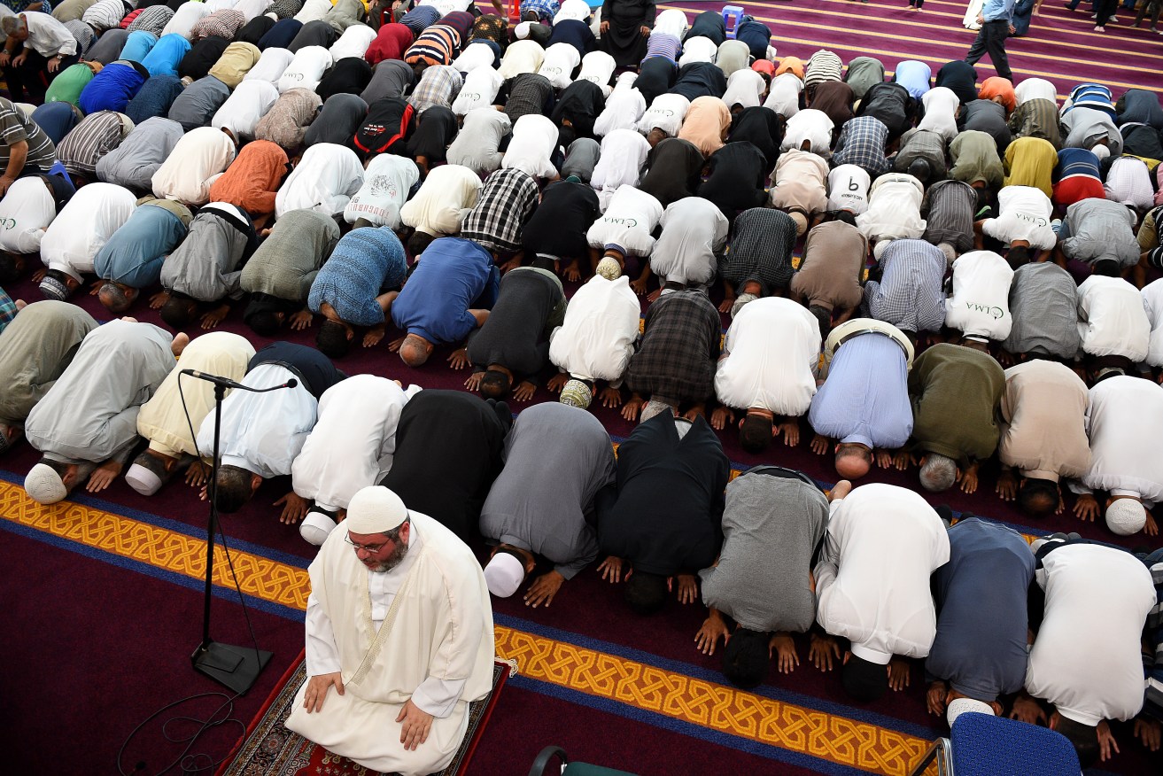 Men at prayer at the Lakemba Mosque in south west Sydney. AAP Image/Dan Himbrechts