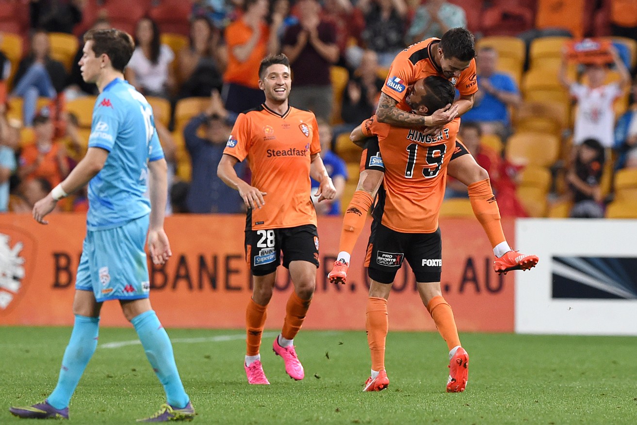 Brisbane's Jamie MacLaren celebrates after scoring a goal against Adelaide United.