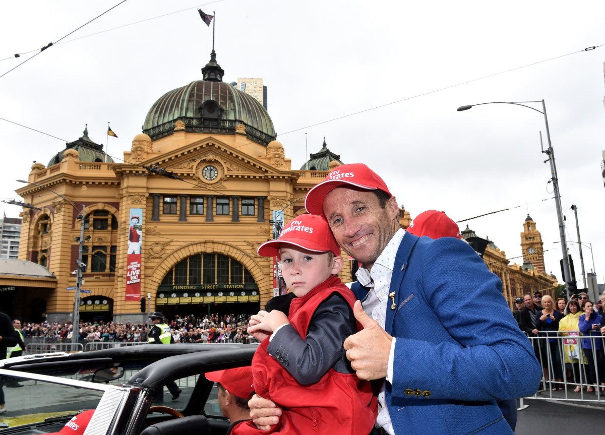 The Offer jockey Damien Oliver (right) and his son Luke are seen during the Melbourne Cup parade in Melbourne, Monday, Nov. 2, 2015. The Melbourne Cup will be held on November 3. (AAP Image/Julian Smith) NO ARCHIVING