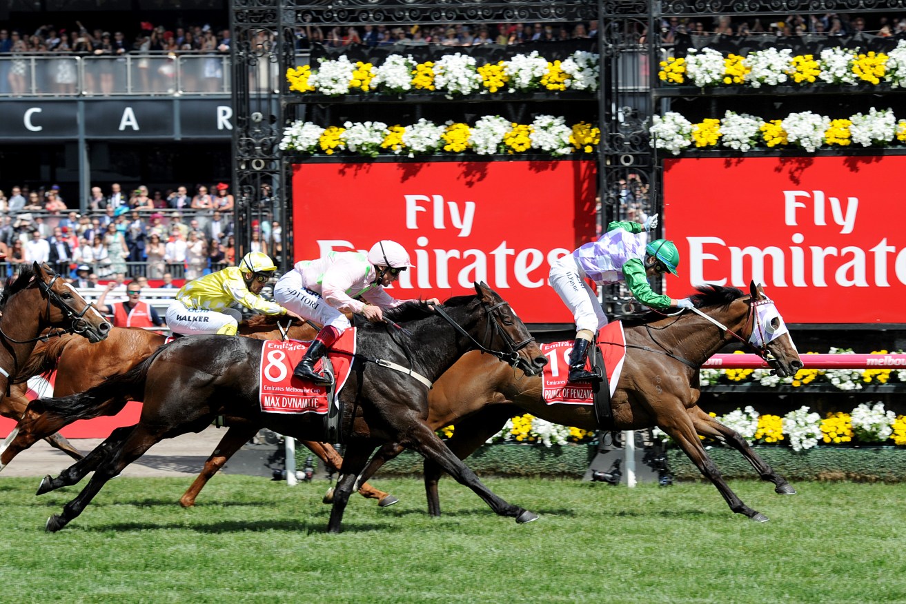 Jockey Michelle Payne riding Prince Of Penzance crosses the finish line to win the 2015 Melbourne Cup.