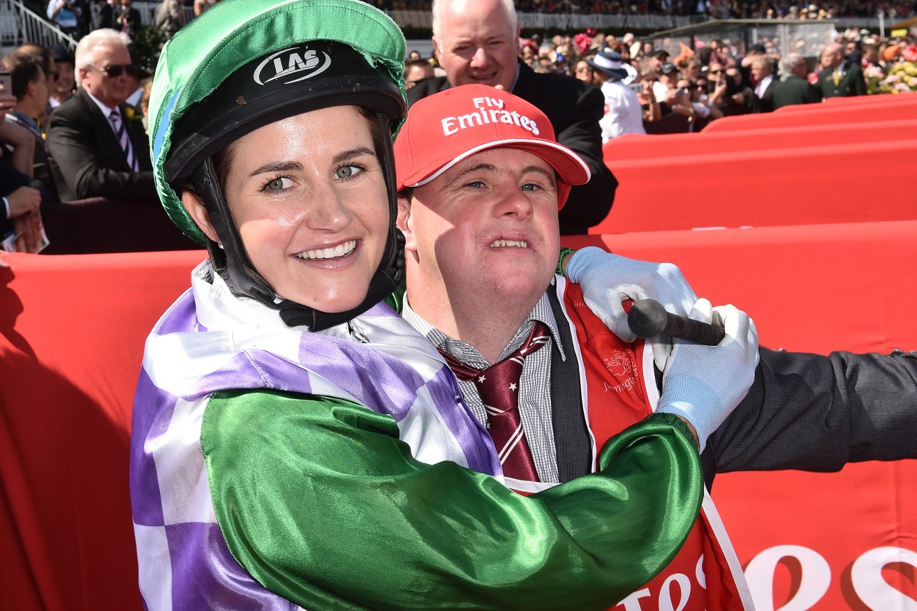 Michelle and brother Steven celebrate after she rode Prince of Penzance to victory in the Melbourne Cup.