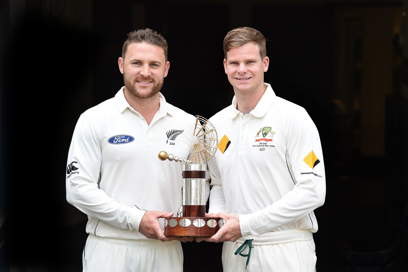 All smiles: Brendon McCullum and Steve Smith pose with the Trans-Tasman Trophy ahead of today's series opener.