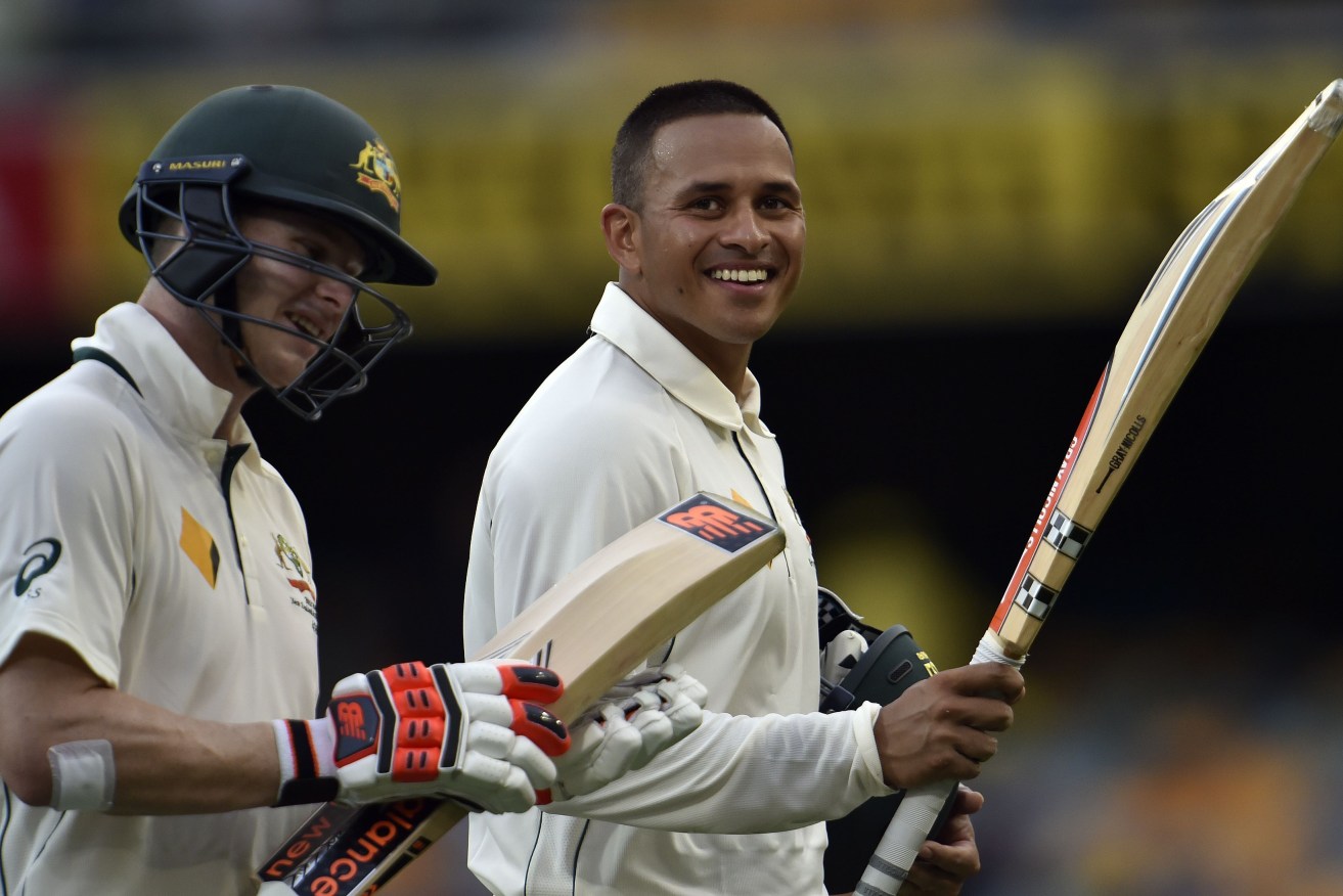 Australia's unbeaten pair Steve Smith and Usman Khawaja return to the pavilion at the end of day one of the first Test.