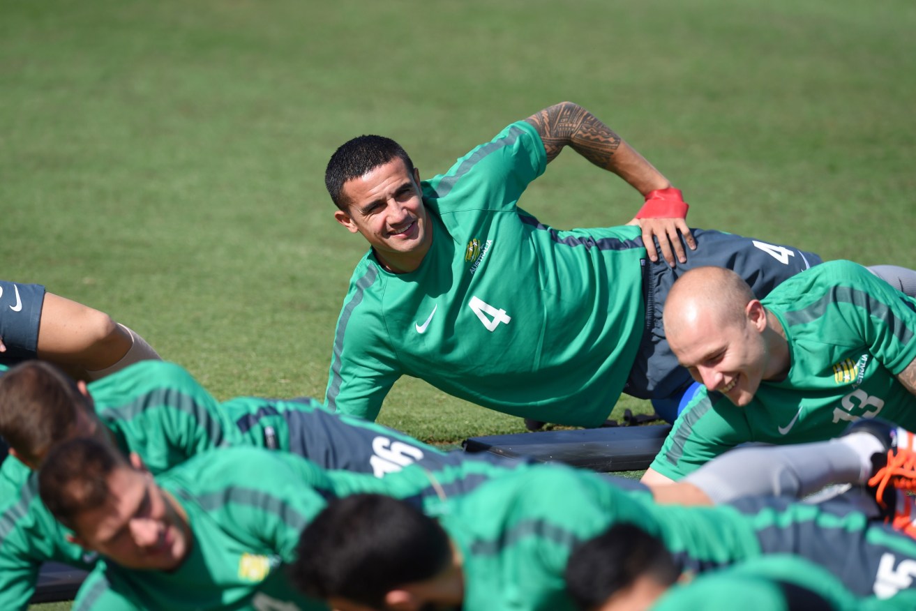 Socceroo Tim Cahill stretches during a training session in Canberra this week.