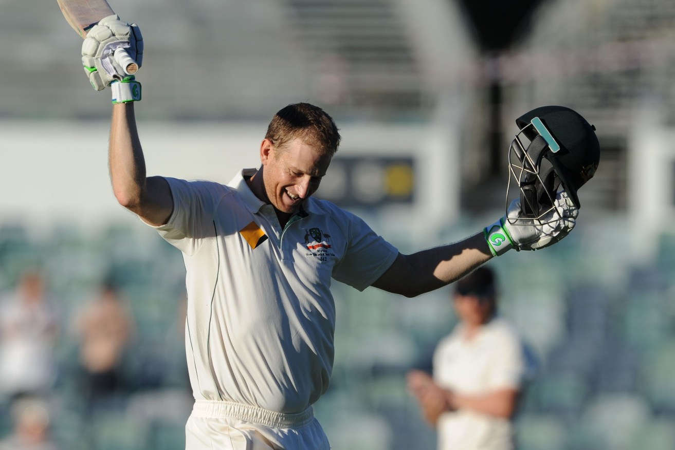 Australia's Adam Voges celebrates after reaching his century on day four of the second Test in Perth. AFP PHOTO / Greg WOOD
