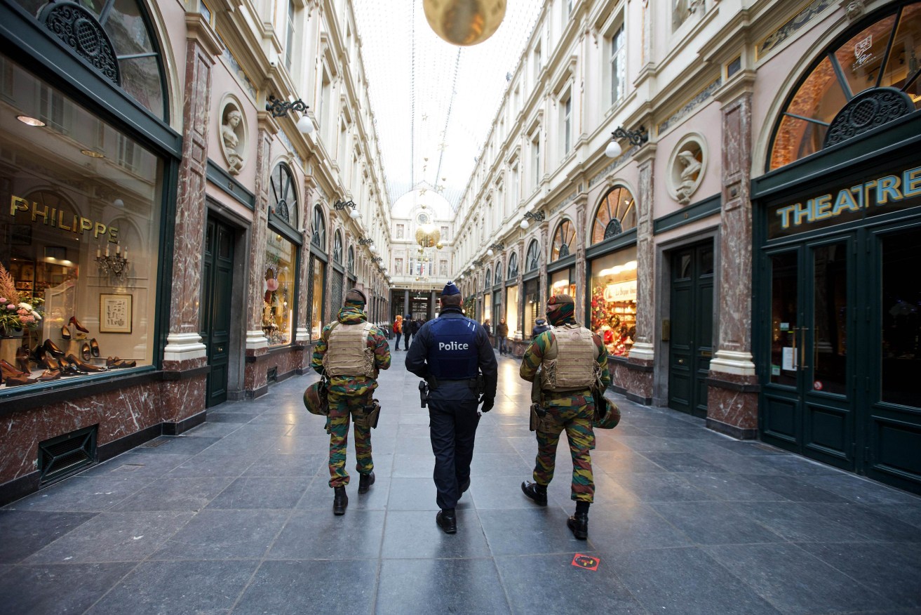Belgian troops patrol at the Royal Galleries of Saint-Hubert in Brussels as the tense Belgian capital was locked down for a second day. AFP PHOTO/BELGA/NICOLAS MAETERLINCK