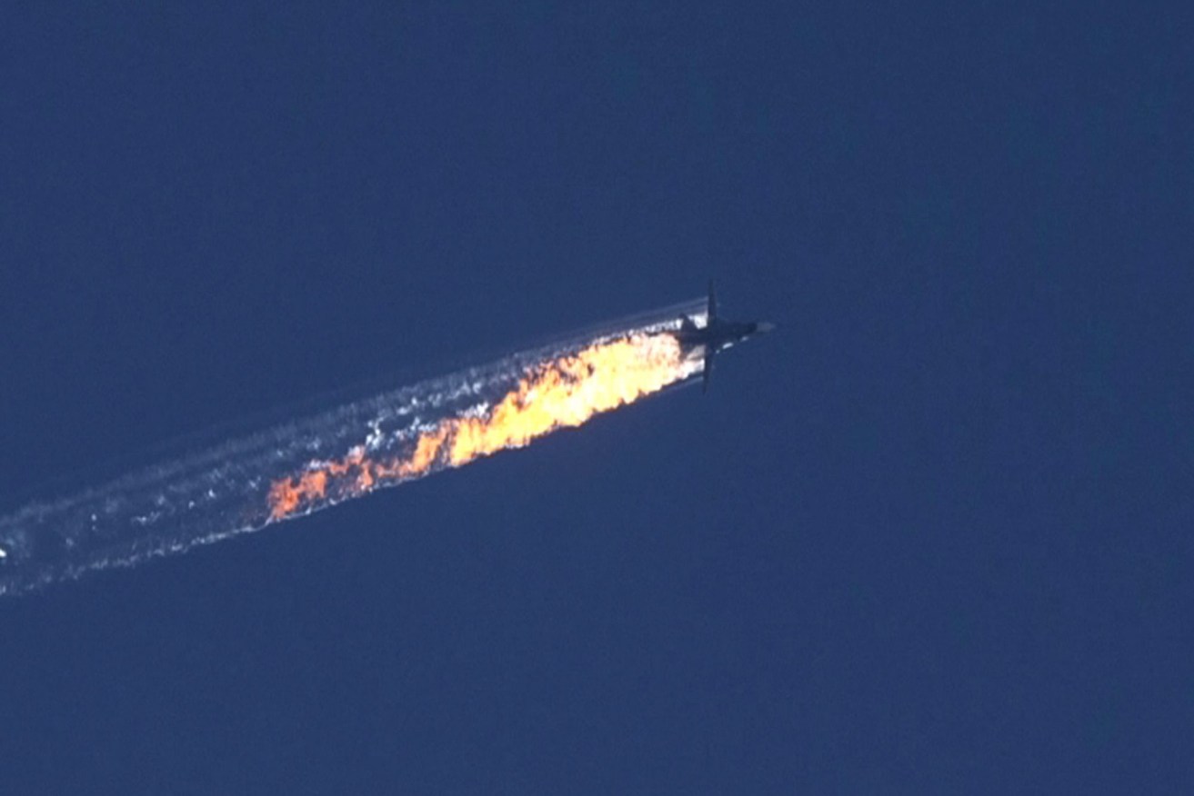 A Russian jet leaves a burning trail after being shot near the Turkish-Syrian border. EPA/HABERTURK TV CHANNEL