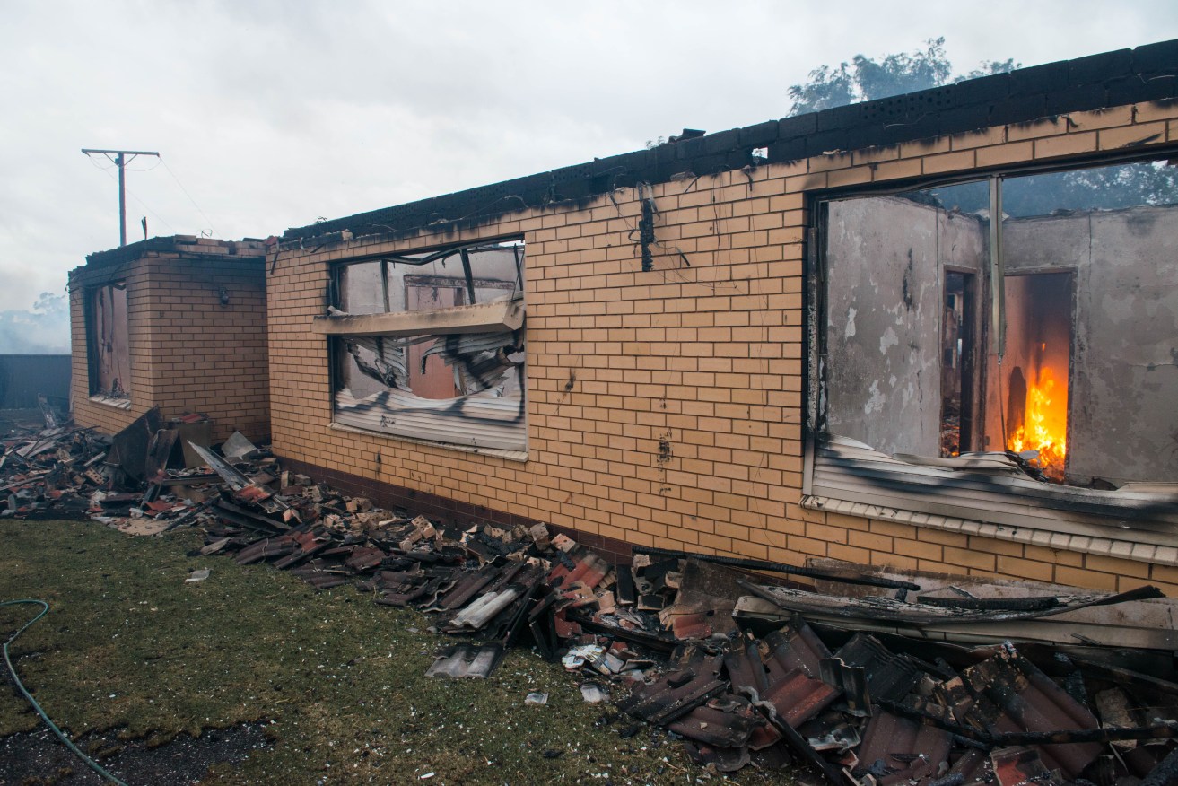 A destroyed house burning near Roseworthy on Wednesday. AAP Image/Brenton Edwards