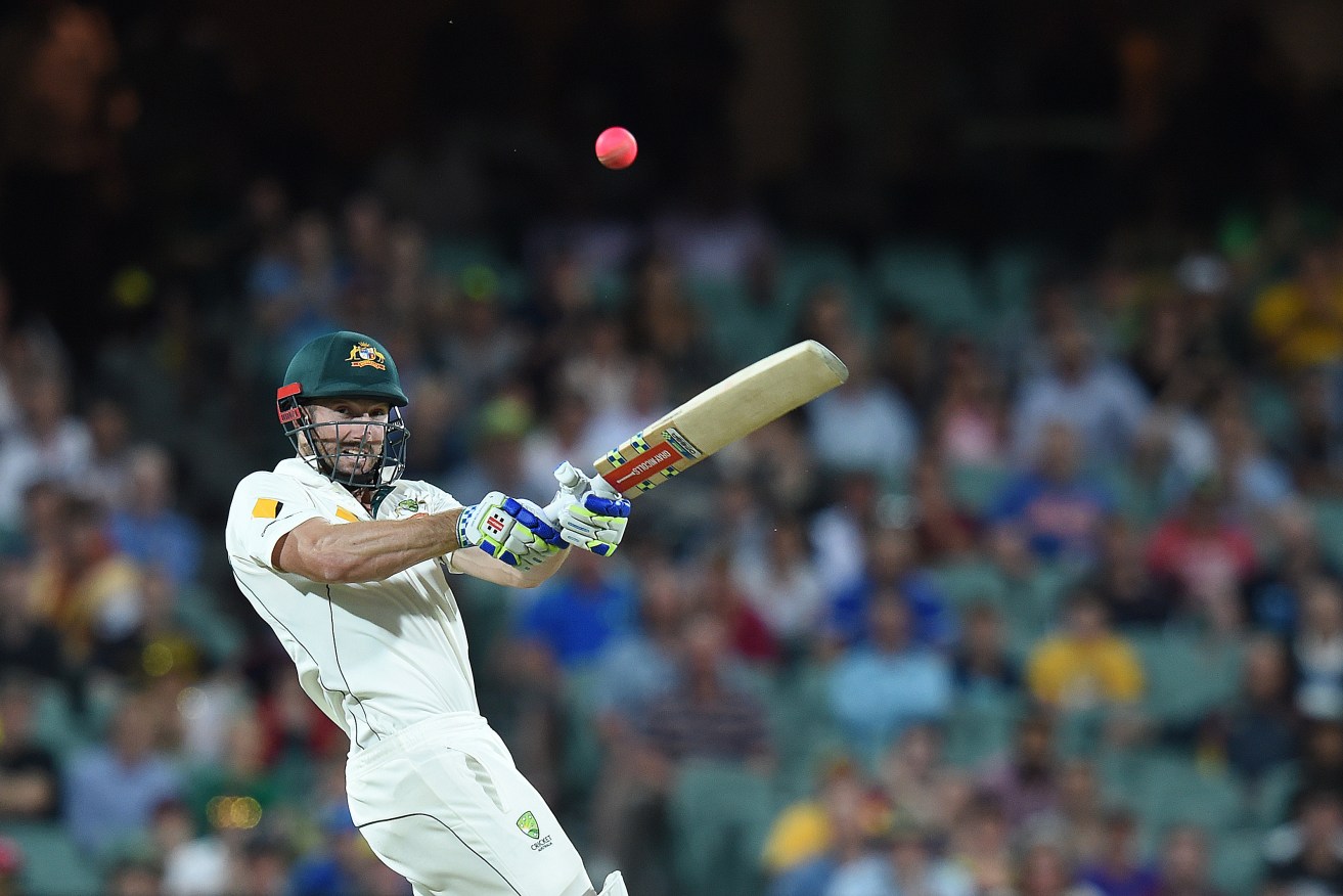 Australian batsman Shaun Marsh hits a boundary in the fourth innings in Adelaide. AAP Image/Dave Hunt