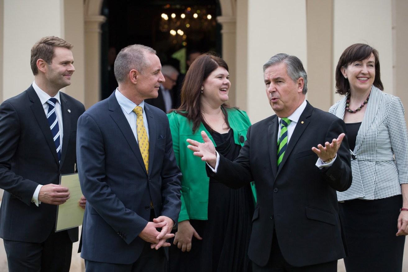 'Labor's action is working': Premier Jay Weatherill and former SA Governor Kevin Scarce with new cabinet members Stephen Mullighan, Zoe Bettison and Susan Close after their swearing-in last year. 