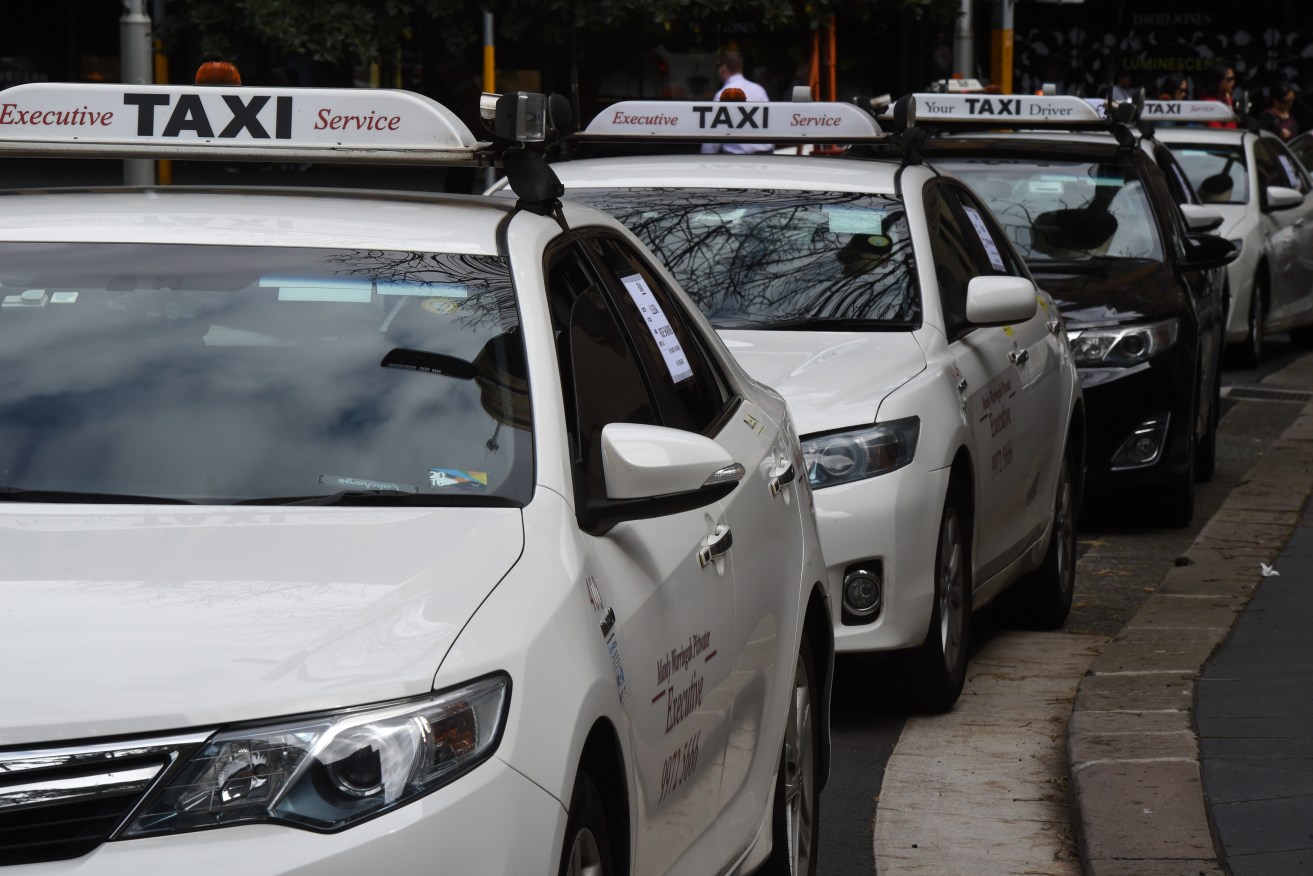 Hundreds of taxis created traffic gridlock around the NSW State Parliament to protest against Uber's overtures into Sydney. Regardless, the ride sharing  company was legalised overnight. Photo: Dean Lewins/AAP