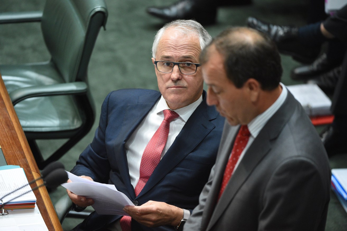 Prime Minister Malcolm Turnbull (left) listens as embattled Special Minister of State Mal Brough responds to Labor in Question Time this week. AAP Image/Mick Tsikas