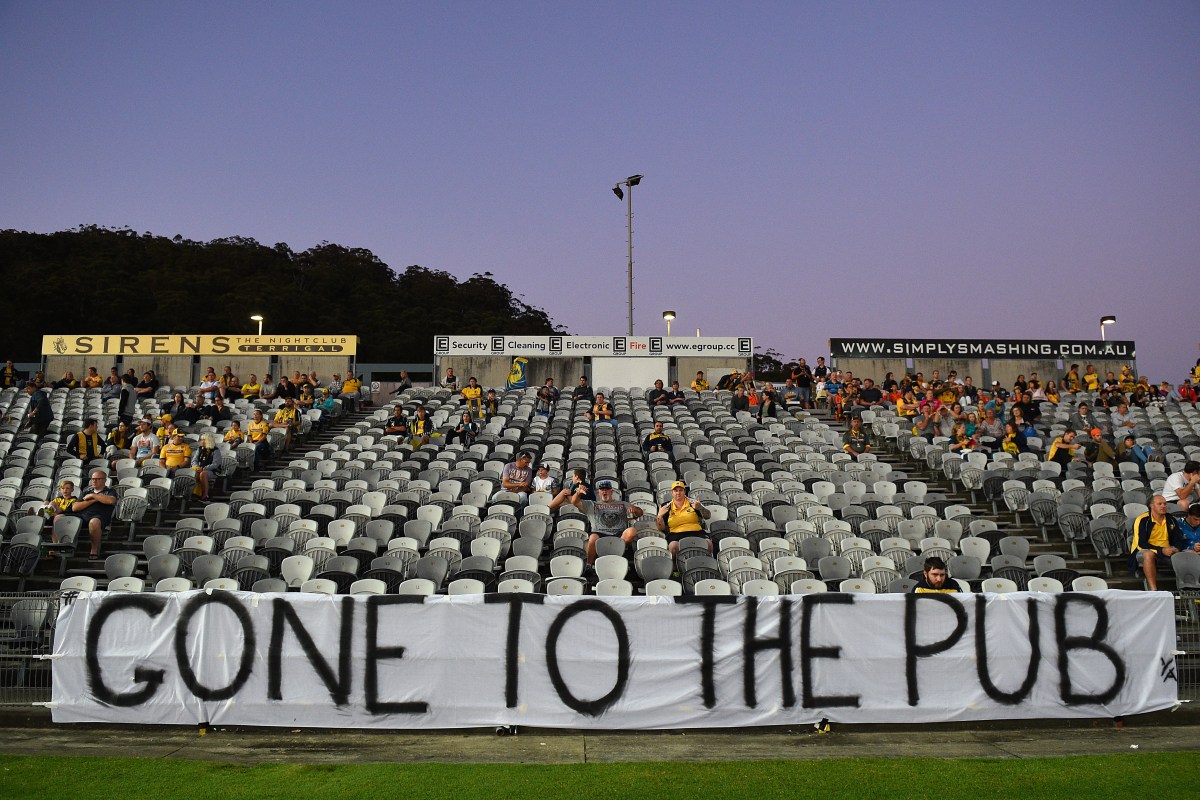 An area of the stands usually populated with the Mariners' core supporter base is seen almost empty with a sign indicating the fans have "gone to the pub", during the round 9 A-League match between the Central Coast Mariners and Melbourne City FC at Central Coast Stadium in Gosford, on Thursday, Dec. 3, 2015. (AAP Image/Dan Himbrechts) NO ARCHIVING, EDITORIAL USE ONLY
