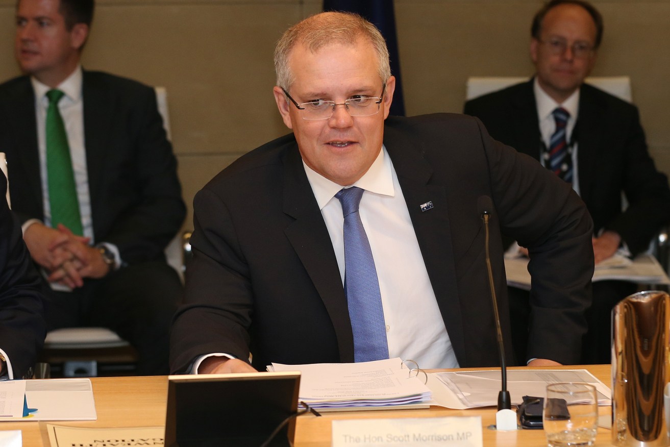 Federal Treasurer Scott Morrison before meeting state and territory counterparts to discuss tax reform. Photo: AAP/David Moir