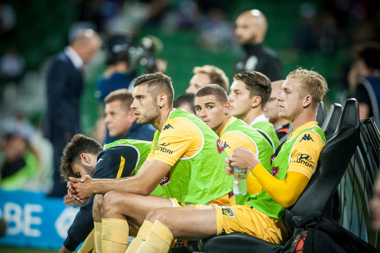 Mariners players on the bench this month. Photo: AAP / Tony McDonough