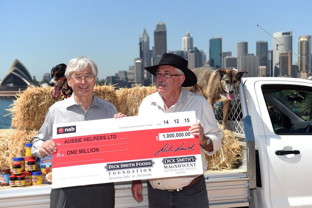 Businessman Dick Smith (left), presents Aussie Helpers charity founder, Brian Egan, with a cheque for $1 million, in Sydney this week. AAP Image/Paul Miller