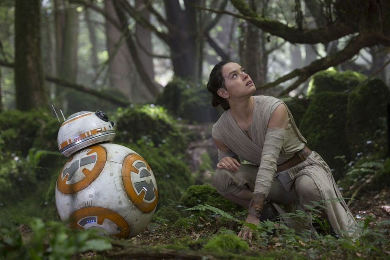 BB-8 is the droid star of the new Star Wars film, pictured here with Daisy Ridley playing Rey. Photo: Disney