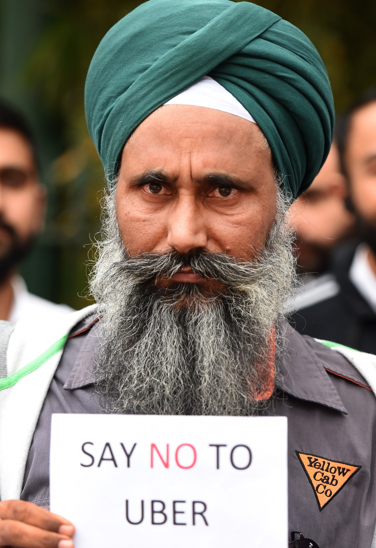 Taxi drivers attend an Uber protest in Brisbane, Thursday, Sept. 10, 2015. They were protesting against the lack of regulation of the Uber ride sharing service. (AAP Image/Dan Peled) NO ARCHIVING
