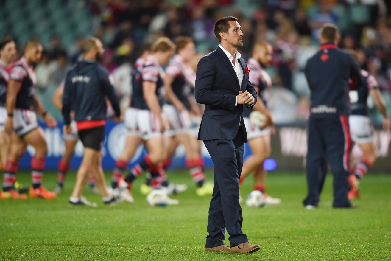 An injured Mitchell Pearce watches his team warm up before last year's NRL Semi Final. Photo: Paul Miller, AAP.