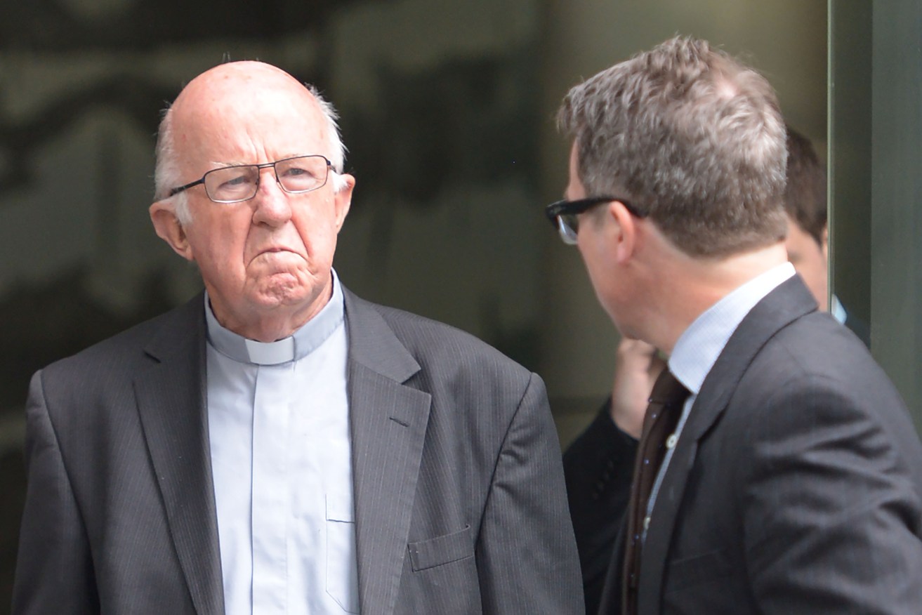 Bishop Peter Connors leaves the Royal Commission into Abuse hearings in Melbourne in November. Connors chaired a 1992 meeting that likened abuse allegations to "ticking time bombs". Photo: Mal Fairclough, AAP.