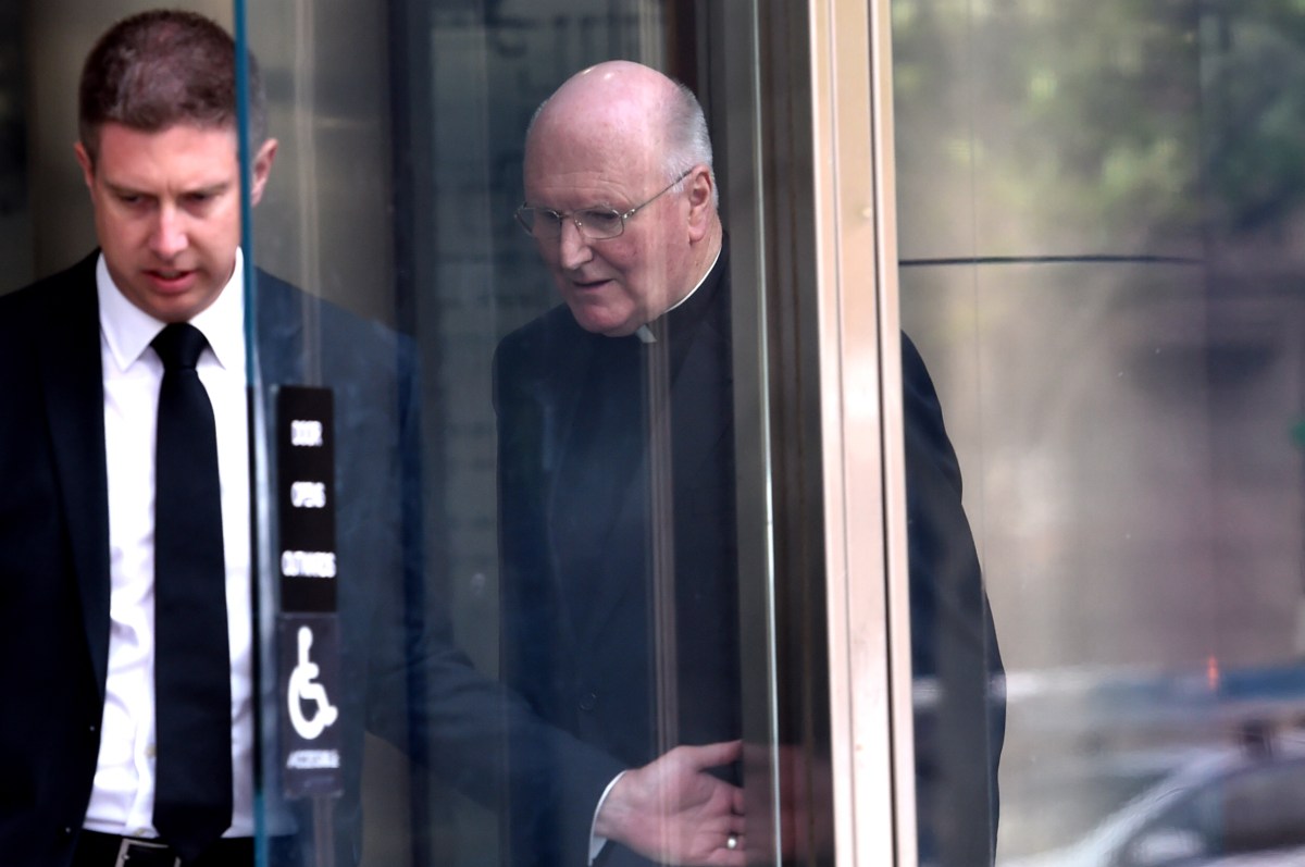 Melbourne Archbishop Denis Hart (right) leaves after giving evidence at The Royal Commission into Institutional Responses to Child Sexual Abuse at the County Court in Melbourne, Monday, Nov. 30, 2015. (AAP Image/Tracey Nearmy) NO ARCHIVING
