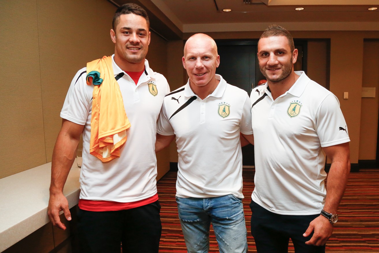 Jarryd Hayne poses with former Socceroo Robbie Slater and NRL star Robbie Farah ahead of tonight's exhibition soccer match between Liverpool and Australian 'Legends', at which Hayne is expected to toss the coin. Photo: Pete Dimovski, AAP.