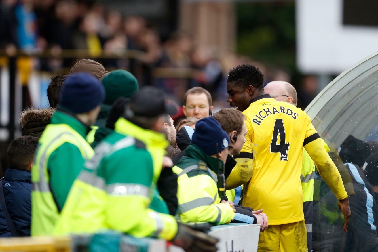 Micah Richards has an altercation with Wycombe supporters in the crowd during the FA Cup match. Photo: Paul Harding/PA Wire.