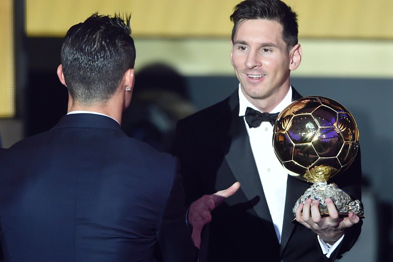Argentina's Lionel Messi is congratulated by Portugal's Cristiano Ronaldo after being awarded the 2015 FIFA Men's soccer player of the year. Photo: VALERIANO DI DOMENICO, EPA.