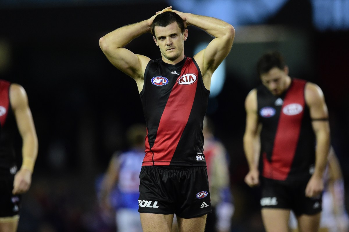 **FILE** An Aug. 2, 2015 file image of Essendon Bombers player Brent Stanton reacts after the game against the Western Bulldogs during round 18 of the AFL at Etihad Stadium in Melbourne. WADA has found 34 past and present Essendon AFL players guilty of using performance enhancing drugs. (AAP Image/Julian Smith) NO ARCHIVING, EDITORIAL USE ONLY