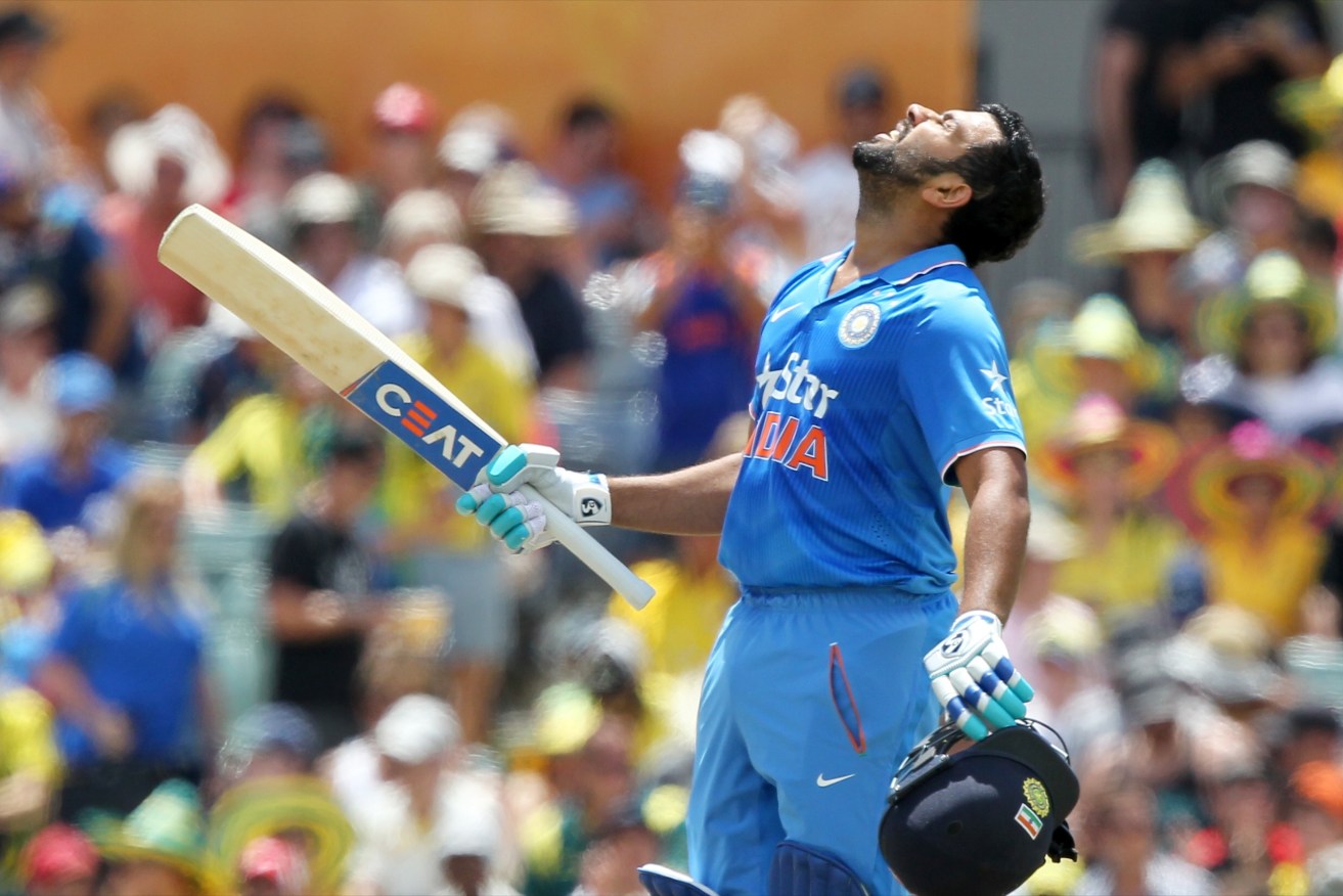 Rohit Sharma looks to the heavens after scoring his century during the first One Day International against Australia. Photo: Richard Wainwright, AAP. 