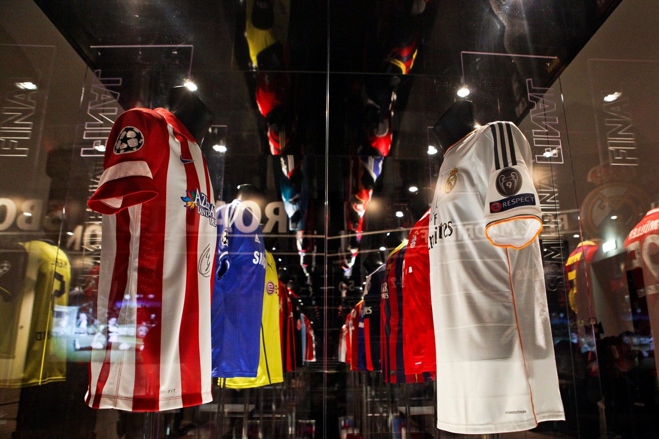 The jerseys of Spanish soccer clubs Atletico Madrid and (right) Real Madrid on display at the UEFA Champions League Gallery in Lisbon. Photo: MARIO CRUZ, EPA.