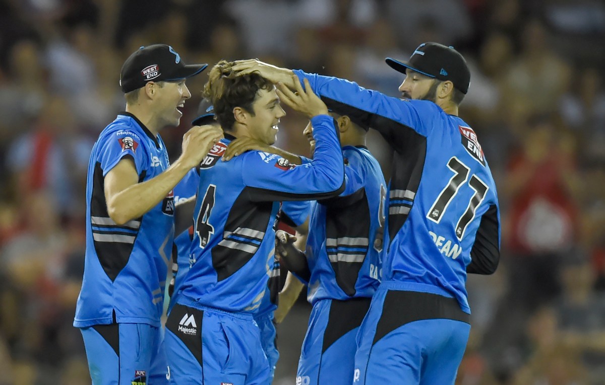 Travis Head (2nd L)celebrates with team-mates after dismissing Chris Gayle during the Big Bash League match 32 between the Melbourne Renegades v Adelaide Strikers at Etihad Stadium in Melbourne, Monday, Jan. 18, 2016. (AAP Image/Mal Fairclough) NO ARCHIVING EDITORIAL USE ONLY, IMAGES TO BE USED FOR NEWS REPORTING PURPOSES ONLY, NO COMMERCIAL USE WHATSOEVER, NO USE IN BOOKS WITHOUT PRIOR WRITTEN CONSENT FROM AAP