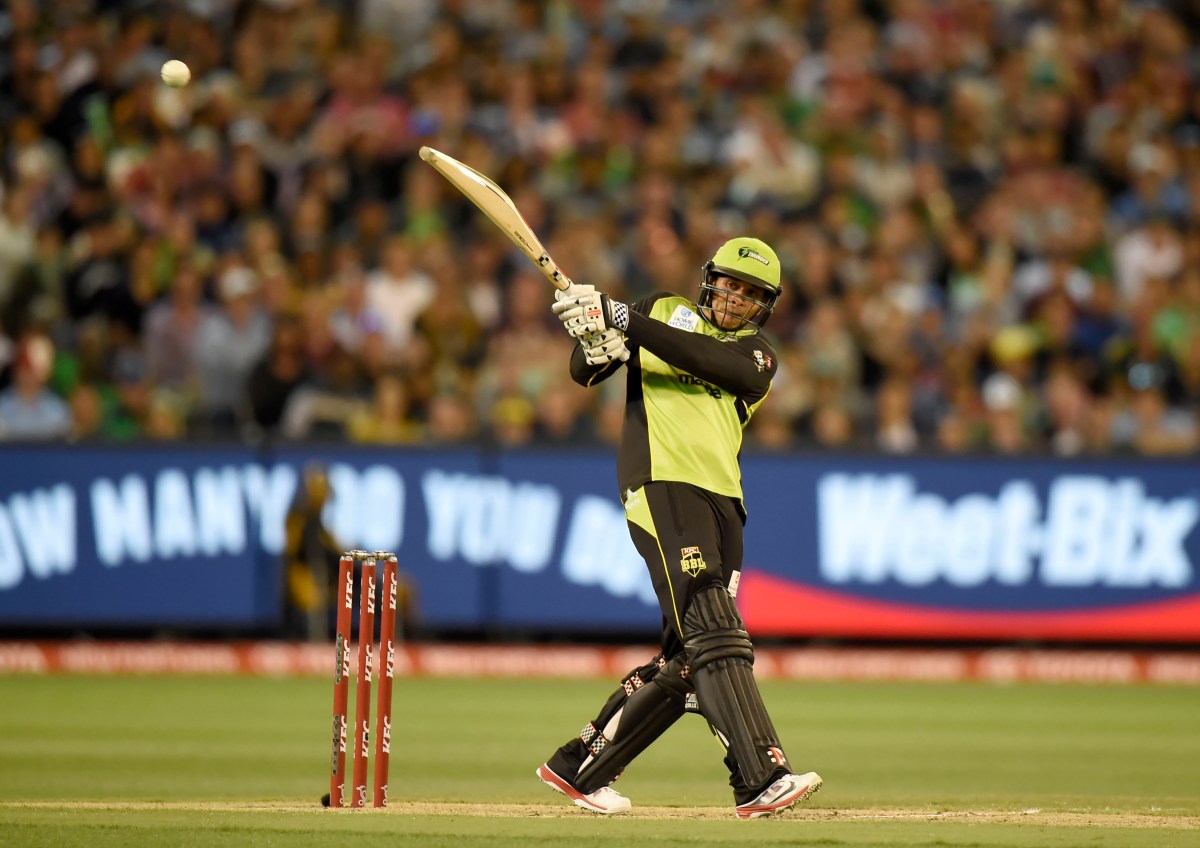 Usman Khawaja launches another ball towards the boundary in the Bash League Final. AAP Image/Mal Fairclough