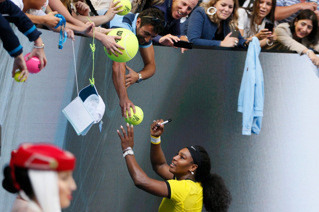 Serena Williams greets fans after defeating  Agnieszka Radwanska in their semi final. Photo: MADE NAGI, EPA.